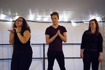 Members of the ASL Club sign to pop songs at Rochester Dinner Revue