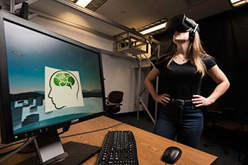 A student playing a virtual reality game