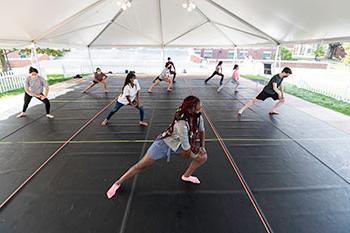 Students stretching before a dance class.